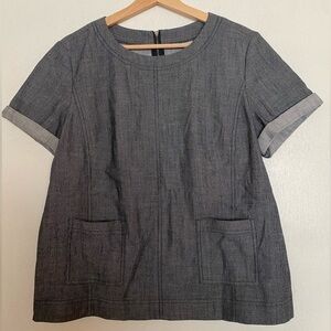 DENIM HALOGEN TOP WITH ROLLED SHORT SLEEVES AND ZIPPER BACK